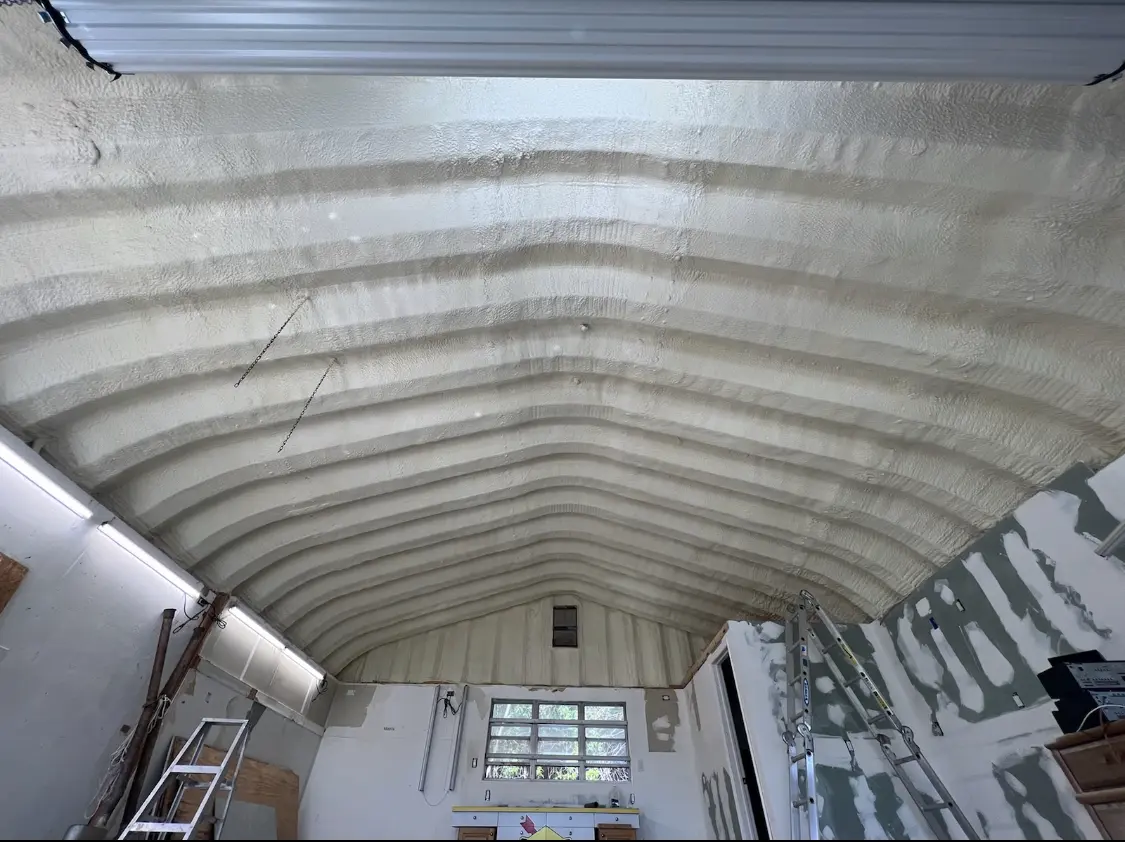 Spray polyurethane foam applied to the underside of a metal roof deck in Marianna